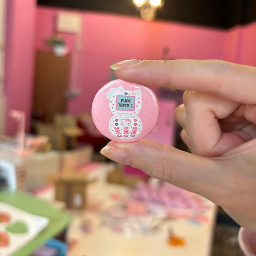 Fuck TERFS hello kitty flip phone badge